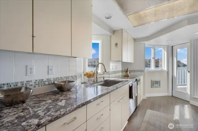 No shortage of light in the kitchen. There is a door onto the patio from here as well as through the living room.