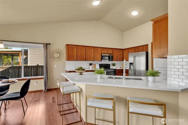Ample diniNew quartz countertops in bathrooms & kitchenng area