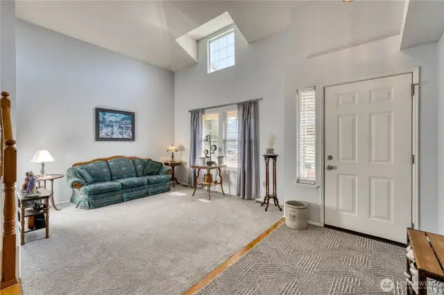 Enter from the covered porch into a large entry and formal living room.