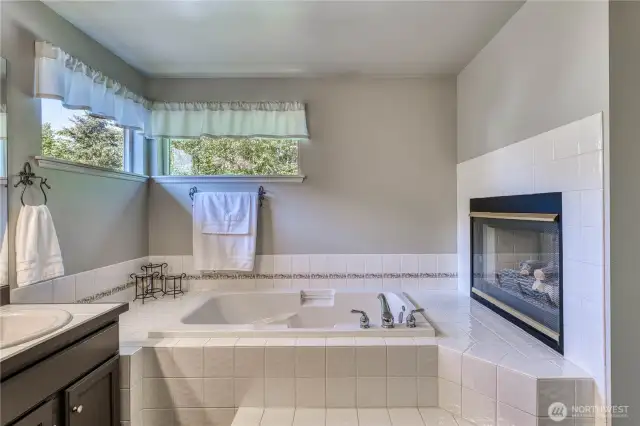 Relax in the deep soaking tub beside the gas fireplace while melting away the days stresses.