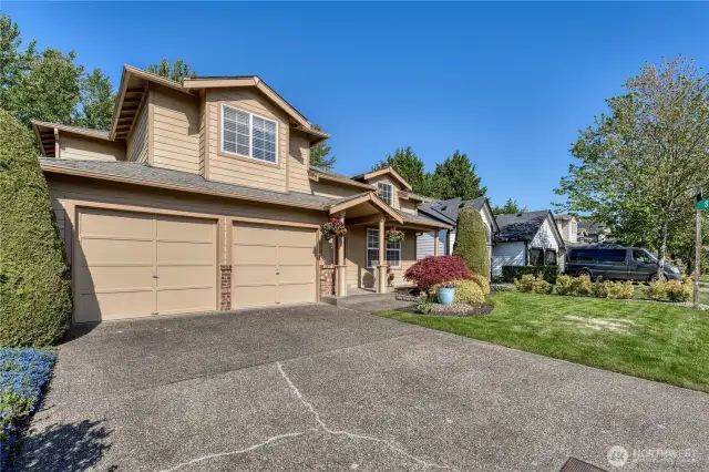 Two car garage with additional room on driveway for parking.