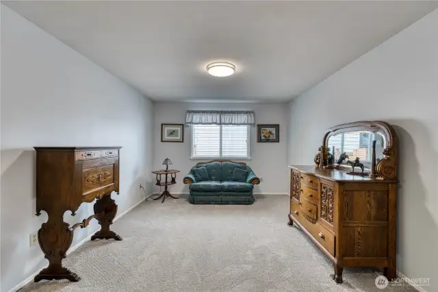 This room would traditionally be the dining room located right off the kitchen area.
