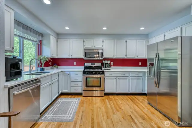 Spacious kitchen with lots of cabinets and counter space makes entertaining a breeze.