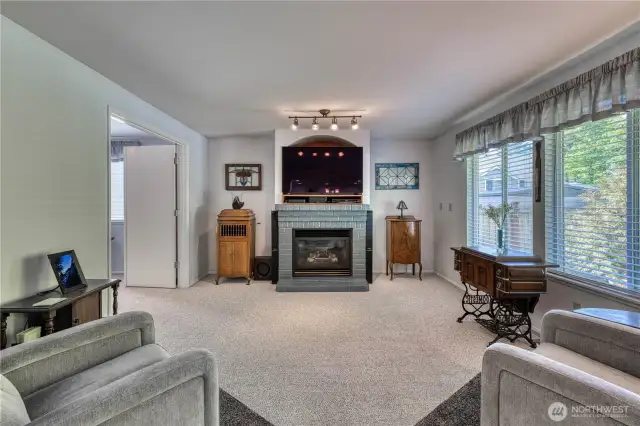 Cozy up to the fireplace while relaxing in the family room.