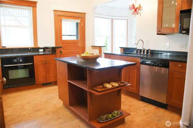 Cork floors, granite counters and modern appliances are convenient, yet still keep the charm of the house