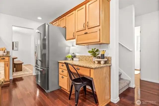 Beautiful, glossy hardwood floors tie together the main floor living spaces.