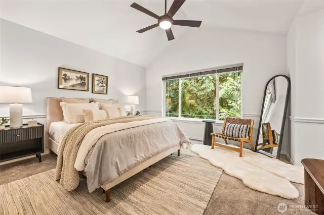 Primary suite with vaulted ceilings, walk-in closet, and 5-piece ensuite bath.