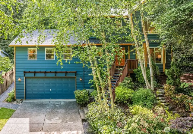 This home is nestled into a 1/2 acre sanctuary down a private lane.