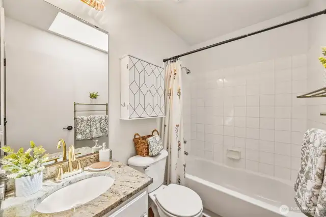 Shared upstairs hallway full bathroom.