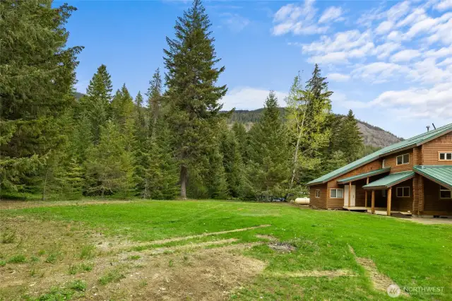 Best of both worlds with useable lawn space and trees on the lot