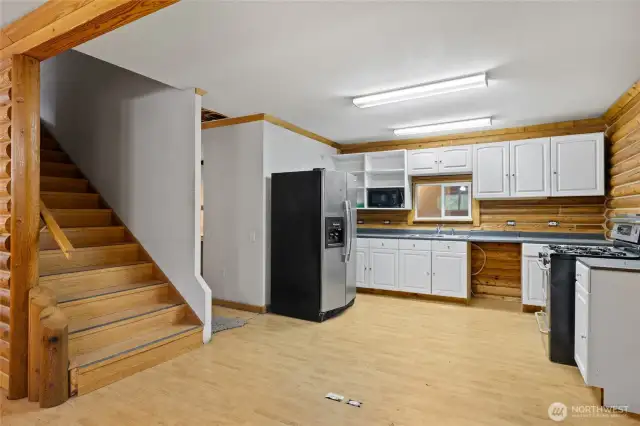 Stairs off the kitchen leading to the bedrooms