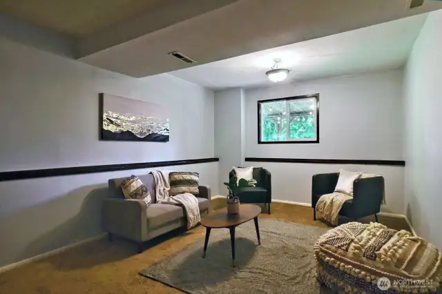 On lower level, there is a nice family room type space.