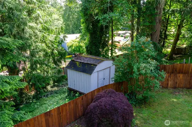 The storage shed is outside the fence, but part of the property,