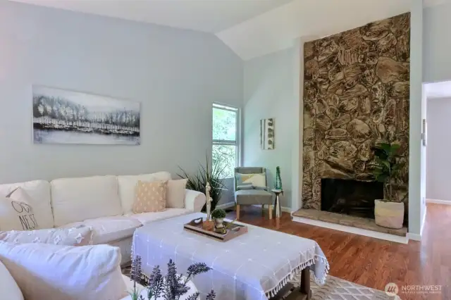 How about this fabulous stone wood-burning fireplace to make things cozy?