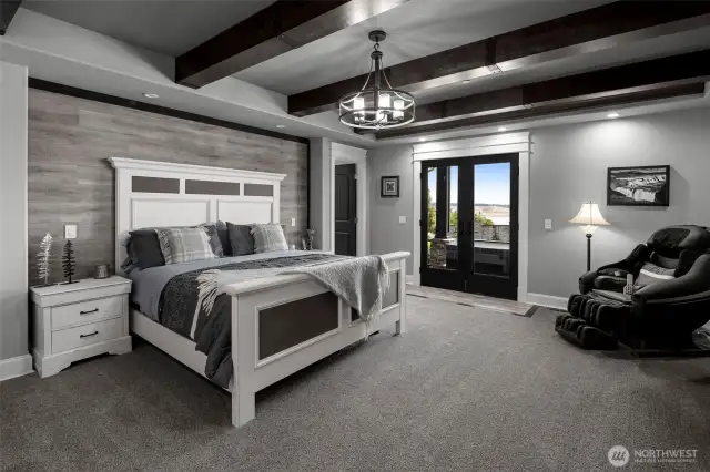 Primary room on main floor of home with french doors to outside hot tub!