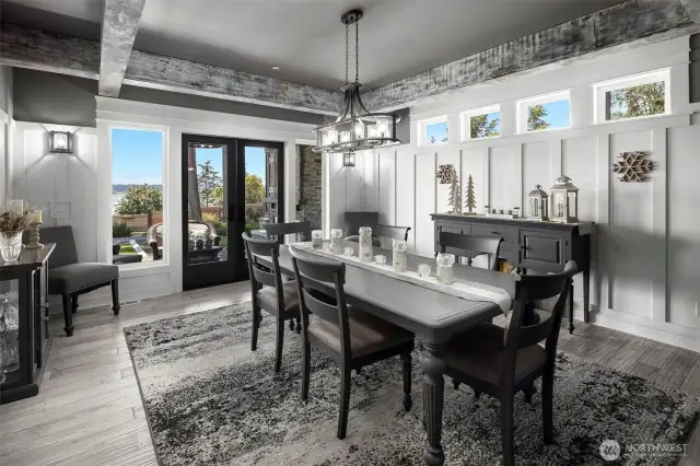 Dining area with doors that open to outdoor covered living space.