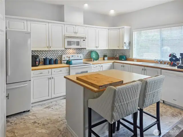 Large kitchen with plenty of natural light.