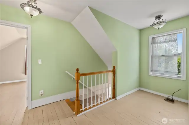Upper level has seating/office area at the top of the stairs, 2 bedrooms and a bathroom.