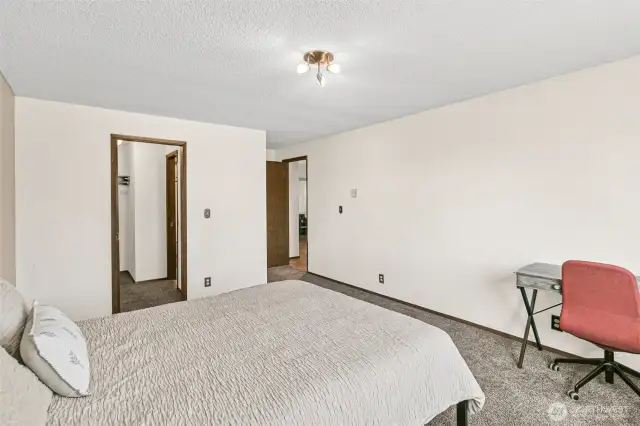 Primary Bedroom + Walk-In Closet.