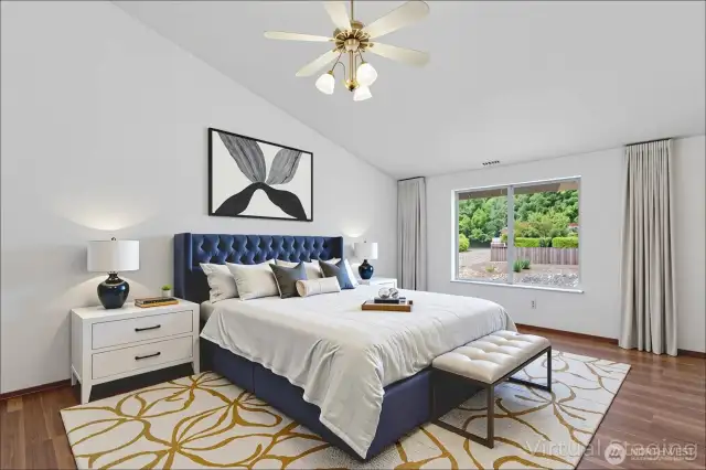 Main bedroom with vaulted ceiling virtually staged