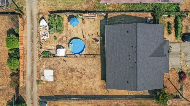 Each unit has a sizable yard. Aerial view shows the street frontage as well as an alleyway access by the backyards.