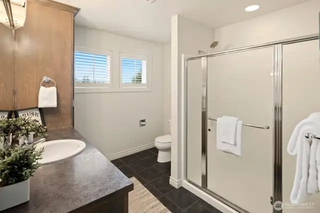 Spacious second bathroom upstairs with generous storage!