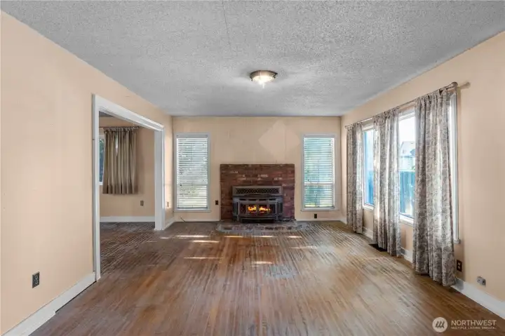The wood fireplace insert is great to keep you warm in the winter. Fire is digitally staged, buyer to confirm functionality.