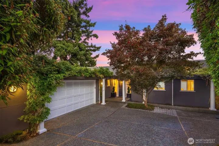 This private driveway leads you to this level entry home with a 2 car garage connected to the home. The clean modern design takes advantage of the location and maximizes the lake and mountain views.