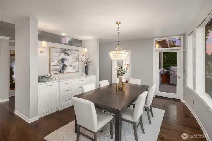 The formal dining room is the heart of the home.  From here you can connect with the living room, kitchen and 2 outdoor decks.  The built ins were added to provide storage but also to ground this space with the new kitchen.