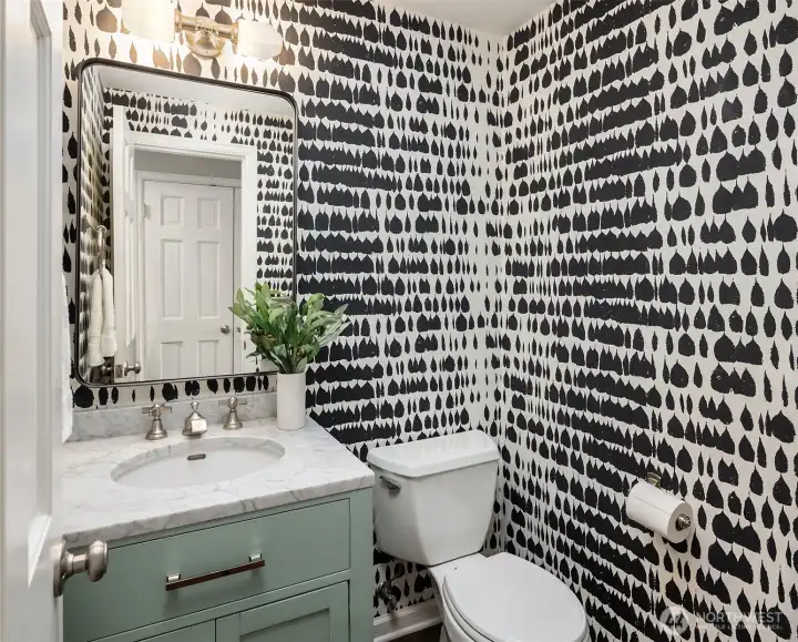 The powder room.  Remodeled and located right off the formal spaces and next to the 2 car garage entry.