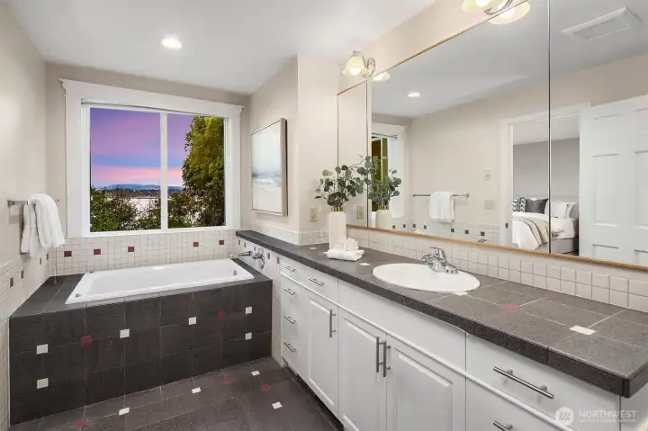 Primary bathroom.  This was the only space that the current owners did not remodel.  This has all the room for your dream suite with extra space from what was a sauna to move the toilet and create a double vanity and room for a freestanding tub.