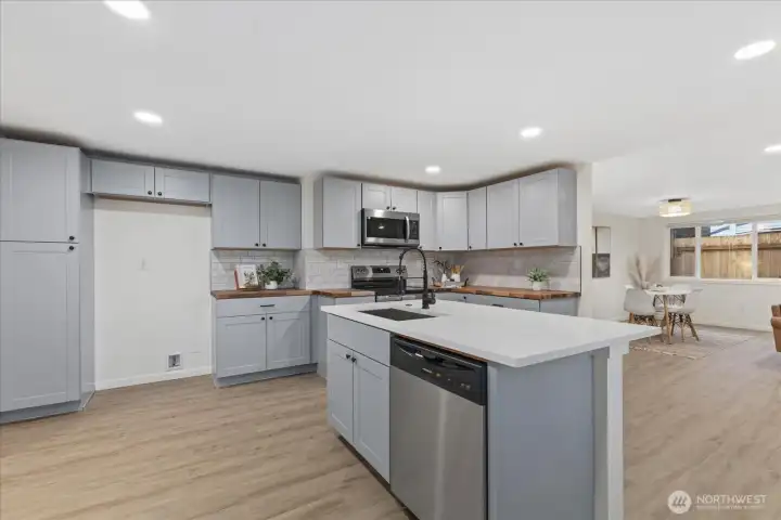 New Kitchen with lots of counter space and room to host.