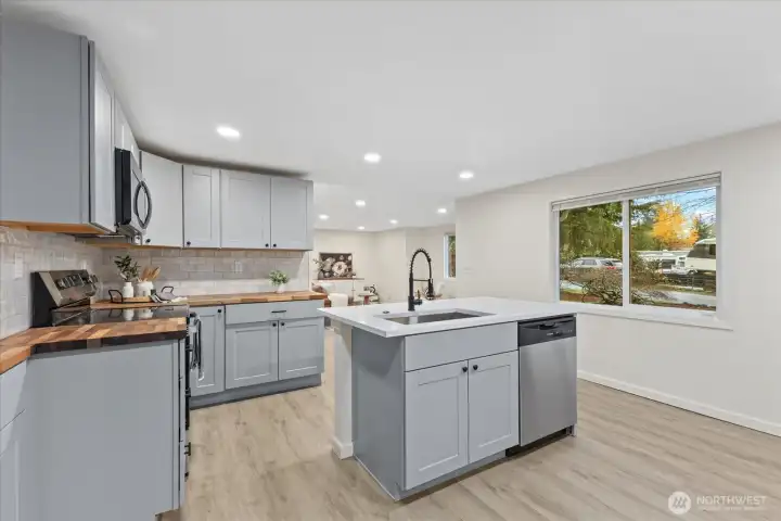 Granite island and butcher block counters.
