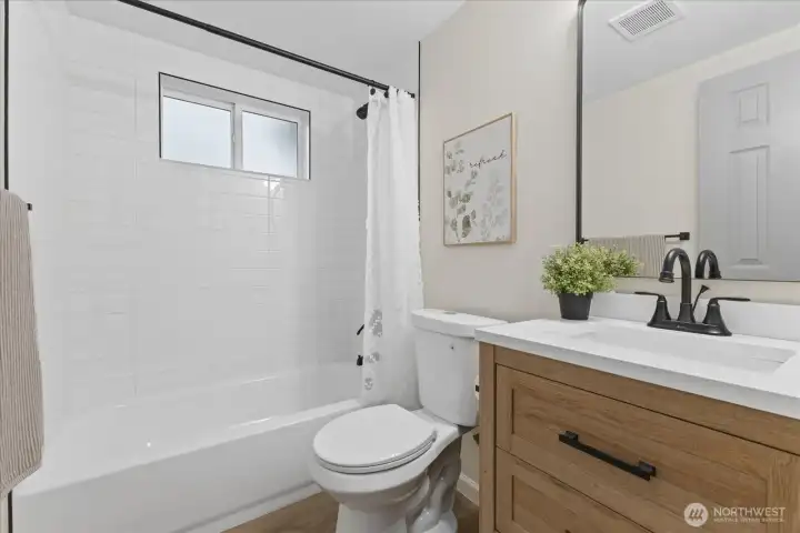 Full bath with beautiful fixtures and design.