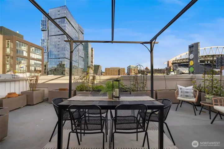 Spacious rooftop terrace offering an ideal setting for outdoor dining, relaxing, or hosting under the open sky.