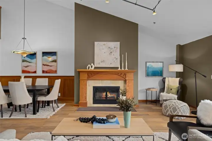 Another perspective of the living area showcasing architectural volume and an abundance of natural light.