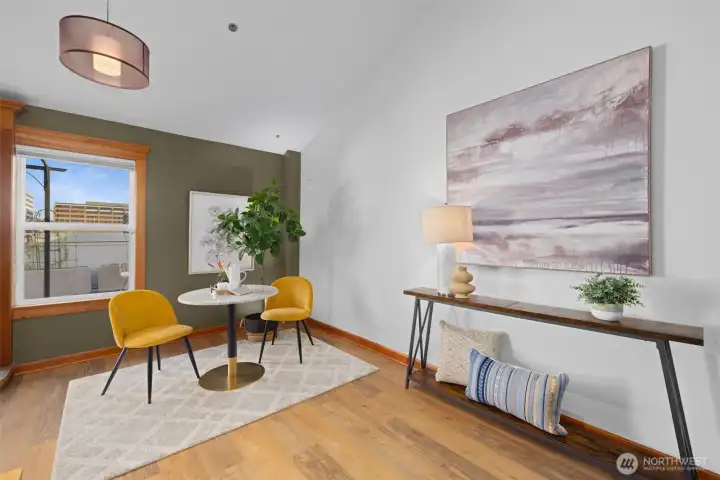 Stylish sitting area with built-in console and oversized windows—perfect as a reading nook, home office moment, or welcome space.