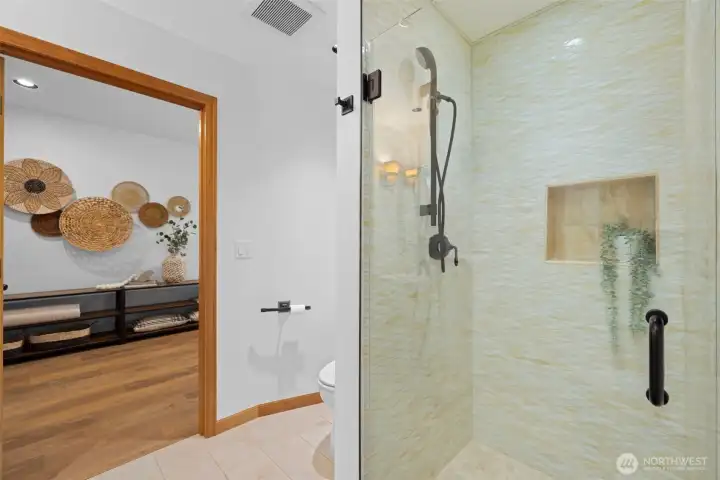 Spa-inspired bathroom featuring a glass-enclosed shower, modern fixtures, and calming, neutral finishes.