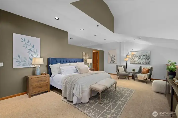 The primary bedroom offers generous space, natural light, and flexibility for guests, office, or additional living needs.