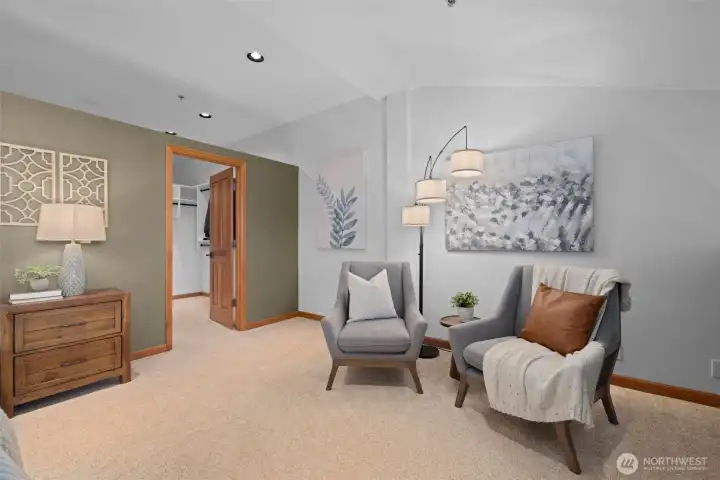 Bonus space in the primary bedroom showcasing plush carpeting and a peaceful, private atmosphere.