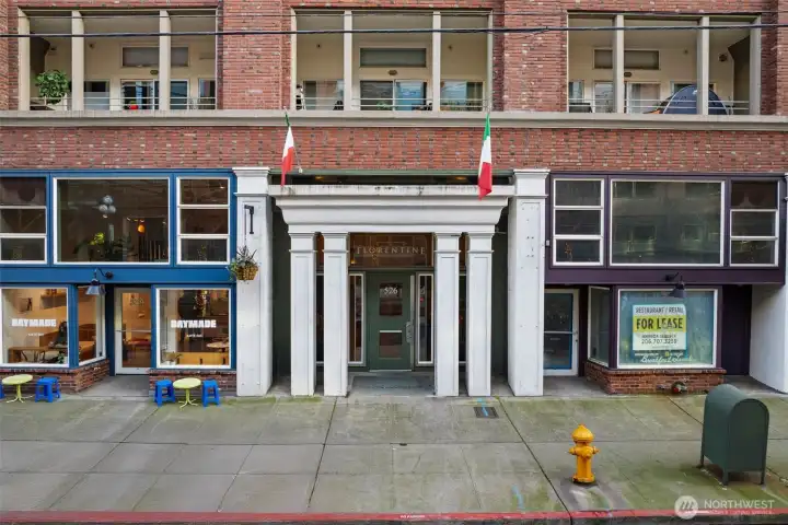 Classic brick façade with secure entry, reflecting timeless architecture and a well-maintained urban building.