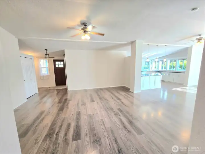 Front living room has open concept to dining and kitchen