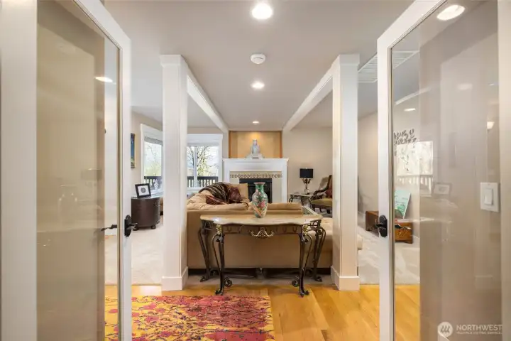 Privacy doors open into family room with beautiful millwork.