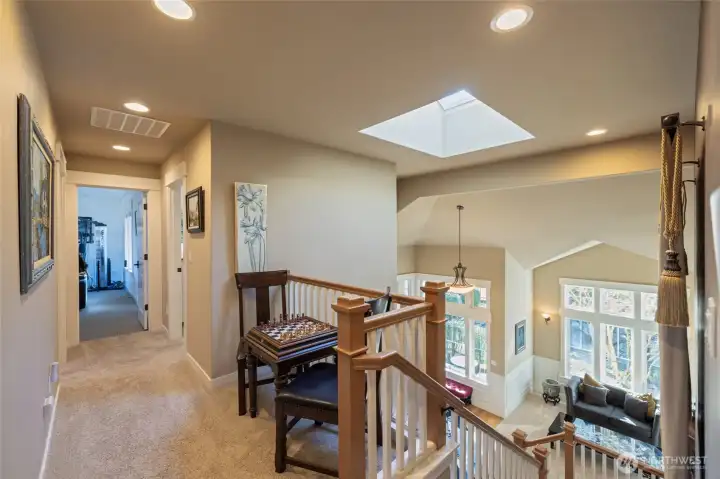 Opening to upper level with 2 bedrooms, primary suite, full bath and rec room