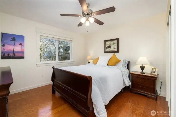 2nd bedroom with wood flooring