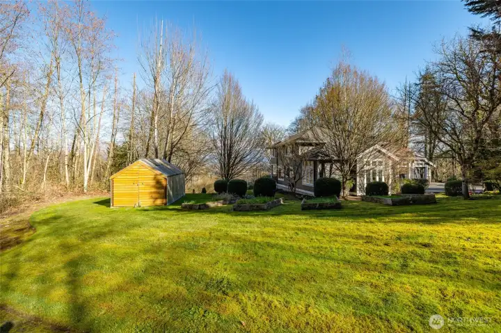 Charming garden shed with a dedicated gardening area, perfect for tools, planting, and seasonal projects