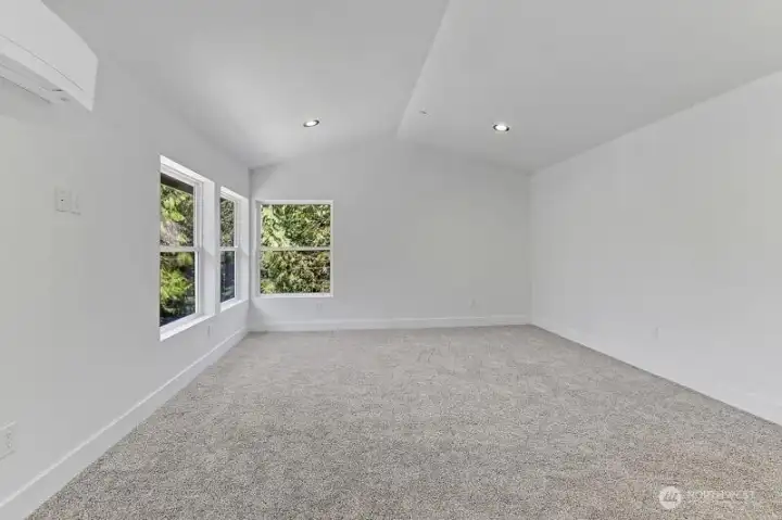 Primary Bedroom w/vaulted ceilings and tons of light