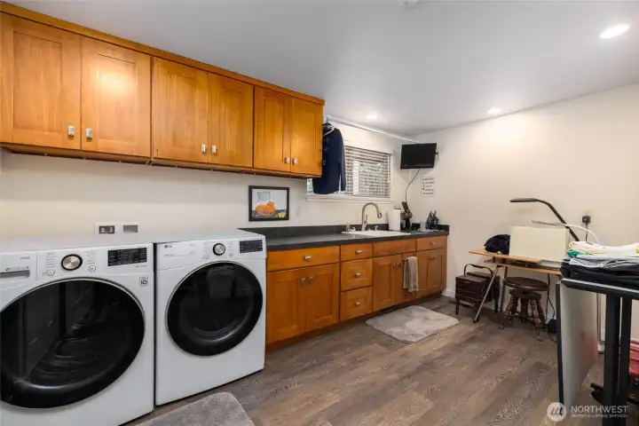 Generous sized utility room, complete with room for crafts, storage, wink and closet.