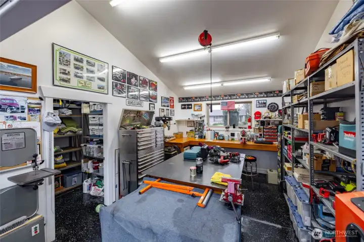 Storage area to the left and robust built-in work bench.  Safe under bench stays.