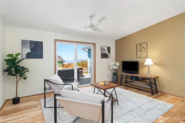 Family room or TV room with access to deck and backyard